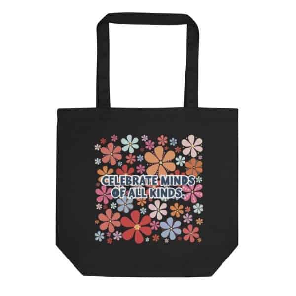 Black tote bag with bright retro floral pring with saying: Celebrate Minds Of All Kinds.